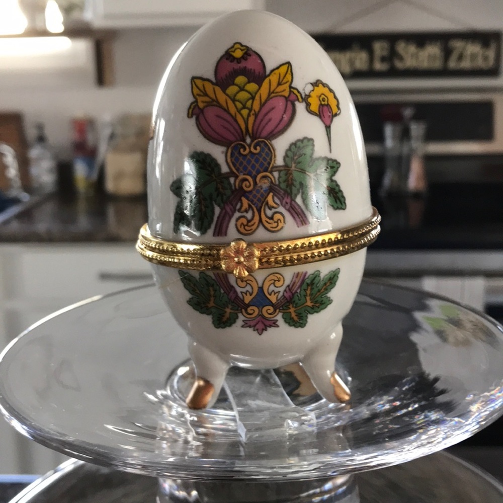 A porcelain painted Egg with Gold trimmings